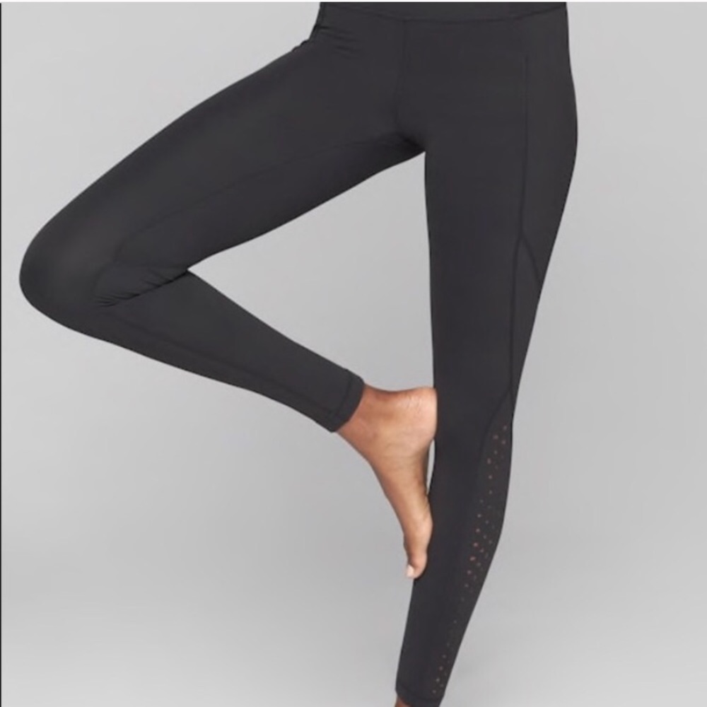 ATHLETA MP side pocket laser cut salutation tight